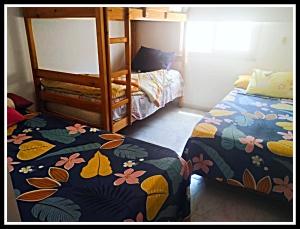a bedroom with two beds and a bunk bed at Rania Chalet -Stella Di Mare Sea view- Families in Ain Sokhna +19 photos