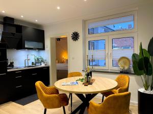 Kuchyň nebo kuchyňský kout v ubytování Ferienwohnung Domizil am Delft II Emden