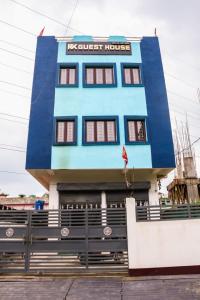 a blue building with a sign on it at RK GUEST HOUSE in Guwahati