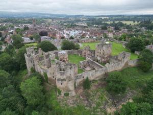 an old castle in the middle of a city at Ludlow Townhouse in Ludlow