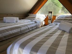 Postel nebo postele na pokoji v ubytování Glamping Tuscany - Podere Cortesi
