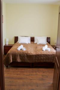 Ein Bett oder Betten in einem Zimmer der Unterkunft Szent János Vendégház