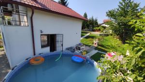 a pool in the backyard of a house at Curovac Nature in Ilidža