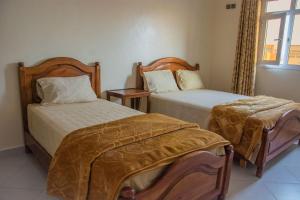Llit o llits en una habitació de Hôtel Afoulki Tiznit