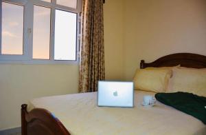 Uma cama ou camas num quarto em Hôtel Afoulki Tiznit