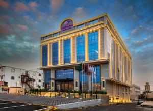 a rendering of a building with blue windows at Boudl Khamis Mushait in Khamis Mushayt