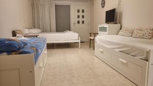 Postel nebo postele na pokoji v ubytování Ionian Dream Home