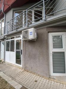 a air conditioner on the side of a house at Enigma Apartmani Divcibare in Divčibare