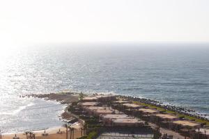 an aerial view of the beach and the ocean at Nabeel Homes - Seaview Rooftop - San Stefano in Alexandria