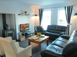 a living room with a couch and a coffee table at Beautiful Holiday Home in Barvaux-sur-Ourthe with Sauna in Barvaux