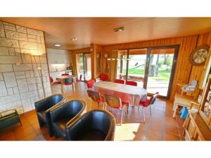 a dining room with a table and chairs at Stunning, wooden villa located in Durbuy in Durbuy
