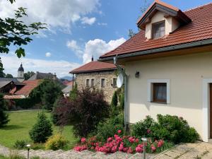 a white house with a red roof at Villa Lypche in Bešeňová