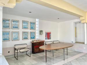 a dining room with a table and two chairs at Beachfront apartment in Roquetas de Mar with communal pool in Roquetas de Mar