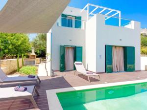 a villa with a swimming pool and a house at Villa in Gerani with Pool and Sea Views in Gerani