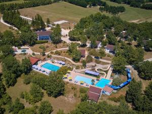 an aerial view of an estate with a swimming pool at Bungalow in France with Private Garden in Mauroux +28 photos