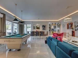 a living room with a pool table in it at Villa in Premantura with Pool near Beach in Premantura