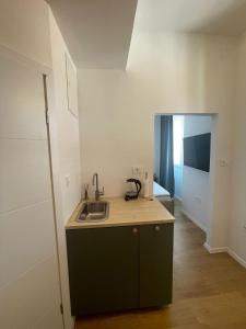 a kitchen with a sink and a counter top at Zadar Enjoy Apartment in Zadar