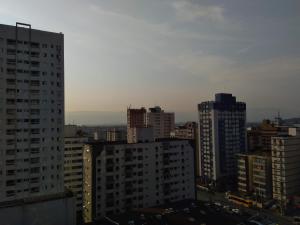 a view of a city skyline with tall buildings at Lindo Studio na Praia do Gonzaguinha II in São Vicente