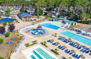 an aerial view of a pool at a resort at Mobil-home Les Dunes de Contis in Saint-Julien-en-Born