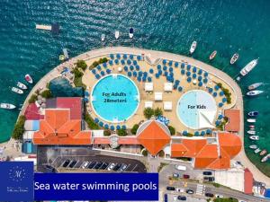 an aerial view of a sea water swimming pool at Hotel Millenium deluxe in Selce