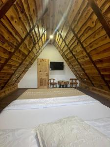 a bedroom with a bed in a attic at Rustic Lodge Plitvice in Jezerce