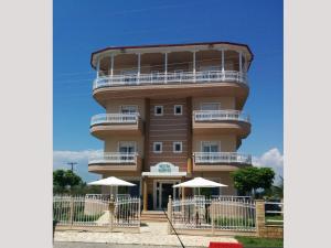a tall building with a balcony on top of it at Hotel Souita in Paralia Katerinis