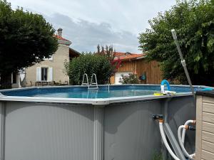 a swimming pool on top of a fence at les trois tilleuls in Loupiac-de-Cadillac