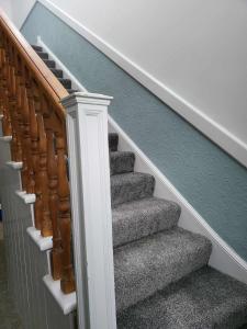 a stairwell with a staircase with grey carpet at 16 Northcote Street, Wick in Wick