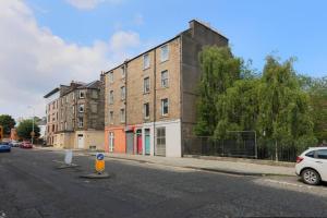 a building on the side of a street at Cosy & Central Broughton 2BR Apt near City Centre in Edinburgh