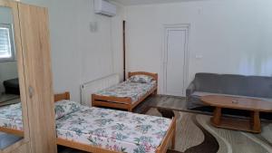 מיטה או מיטות בחדר ב-Apartman Natasa