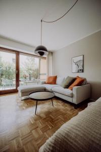 a living room with a couch and a table at Stylisches Design-Apartment in Bad Tölz