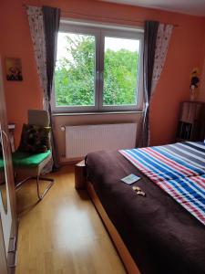 En eller flere senge i et værelse på Ferienwohnung Marsteller in Fulda Gläserzell mit Wlan