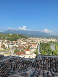 a view of a city from the roof of a building at Aria Baci Guest House in Berat