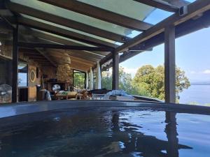 a swimming pool in the middle of a house at Hobbit house Beli in Beli