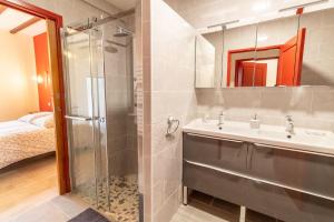 a bathroom with a sink and a shower at LA BUANDERIE in Jonzac +13 photos