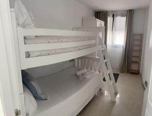 Postel nebo postele na pokoji v ubytování Apartamento Turístico Julia Gemella Acci