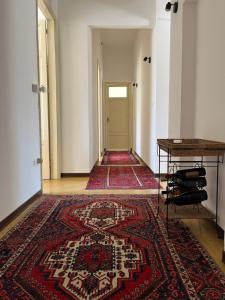 an empty hallway with a rug on the floor at STAR HOUSE CASA VACANZE in Marsala