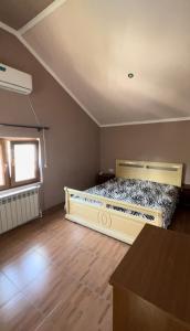 a bedroom with a large bed in a room at Dinadav house in Garni