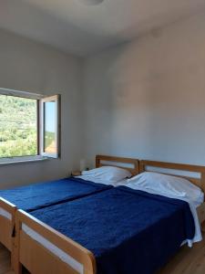 Ένα ή περισσότερα κρεβάτια σε δωμάτιο στο Rooms Androvic