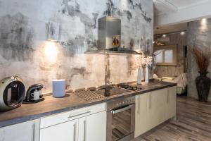 a kitchen with a sink and a stove at Unique Luxury House in Athens