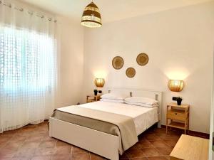 Кровать или кровати в номере Villa singola Amanda - 500m dal mare