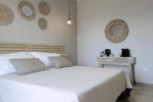 Cama o camas de una habitación en Sunrise Sardinia Posada