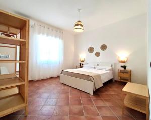 Кровать или кровати в номере Villa singola Amanda - 500m dal mare