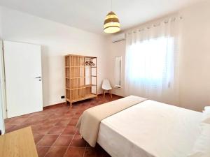 Кровать или кровати в номере Villa singola Amanda - 500m dal mare