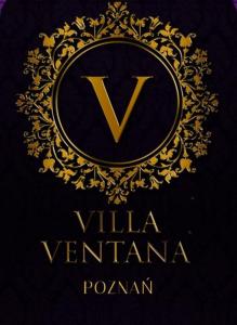 einen goldenen Buchstaben v auf schwarzem Hintergrund in der Unterkunft Villa Ventana 2 City Free Parking Śniadanie w cenie 503 18 18 11 in Posen