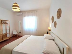 Кровать или кровати в номере Villa singola Amanda - 500m dal mare
