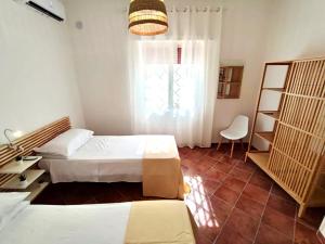 Кровать или кровати в номере Villa singola Amanda - 500m dal mare