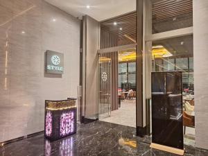 a lobby of a building with a sign on the wall at The Platinum 2 Kuala Lumpur by HOLMA in Kuala Lumpur