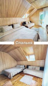 two beds in a room with wooden walls at Sadyba Zatyshok in Maidan Village