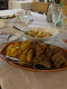a table with a plate of food on a table at Terra Luso Proche De Montejunto in Cadaval